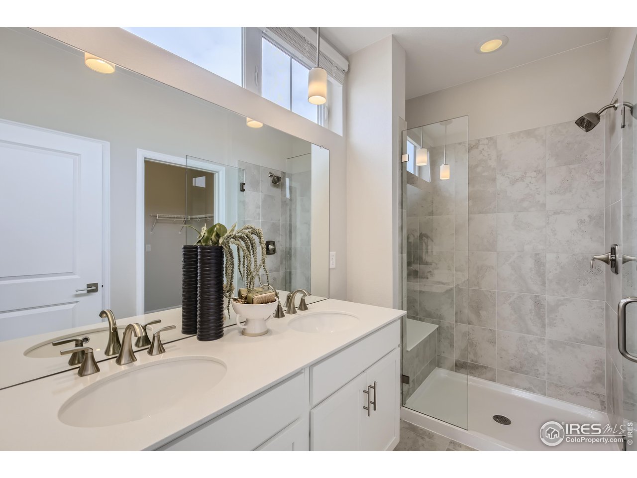 1002 Collamer Drive, Unit 8 Fort Collins, CO 80524 - Photo 24 of 39 a bathroom with a sink shower and a mirror