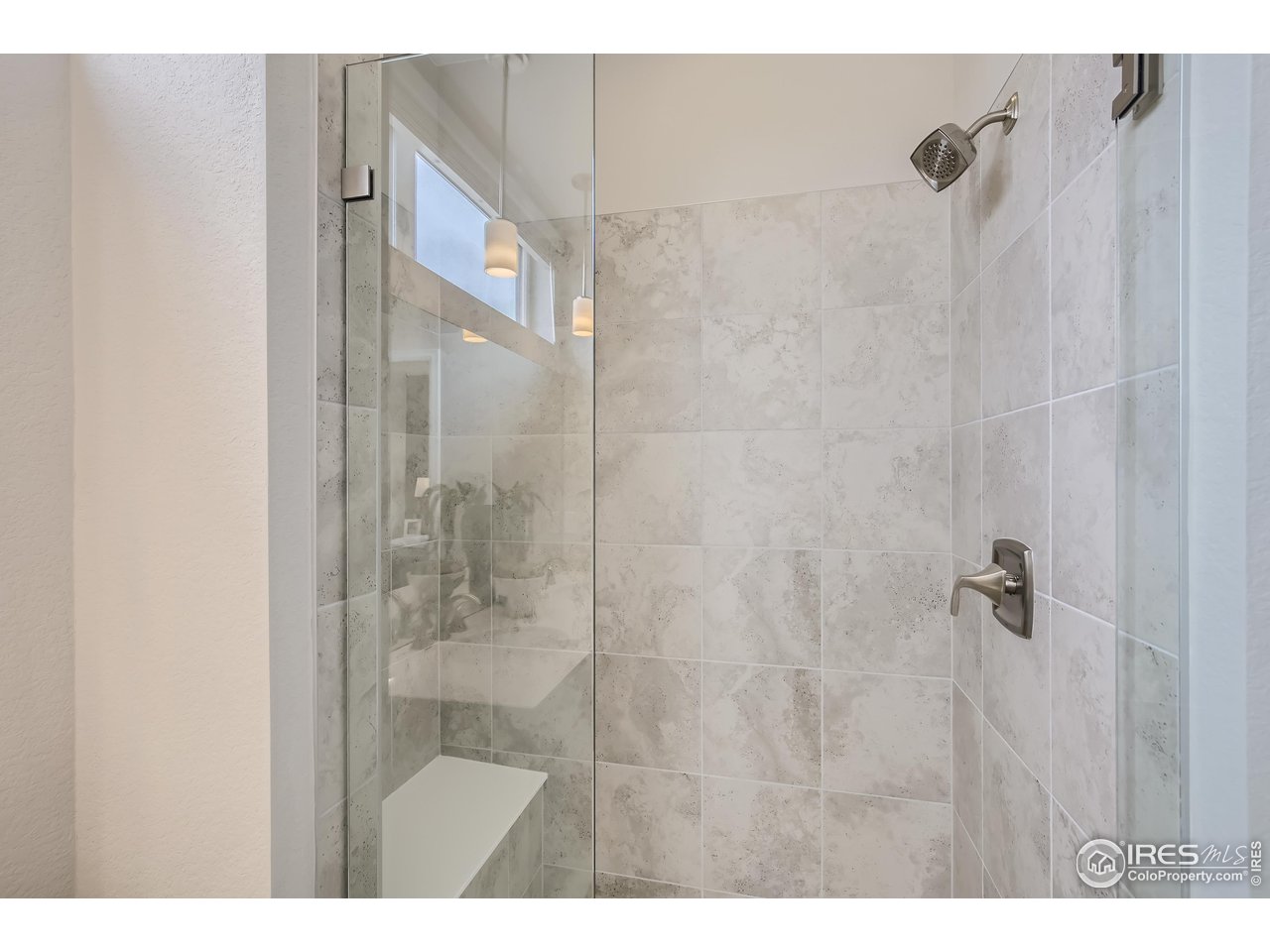 1002 Collamer Drive, Unit 8 Fort Collins, CO 80524 - Photo 25 of 39 a bathroom with a glass shower door