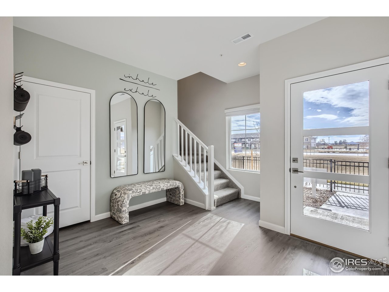 1002 Collamer Drive, Unit 8 Fort Collins, CO 80524 - Photo 30 of 39 a view of an entryway with wooden floor