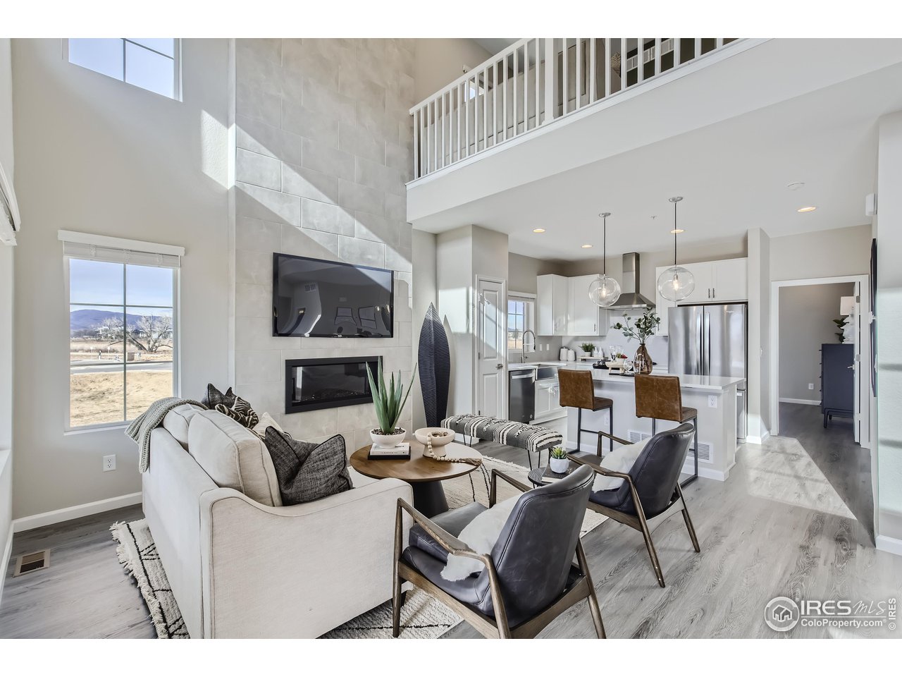 1002 Collamer Drive, Unit 8 Fort Collins, CO 80524 - Photo 12 of 39 a living room with furniture a fireplace and a flat screen tv