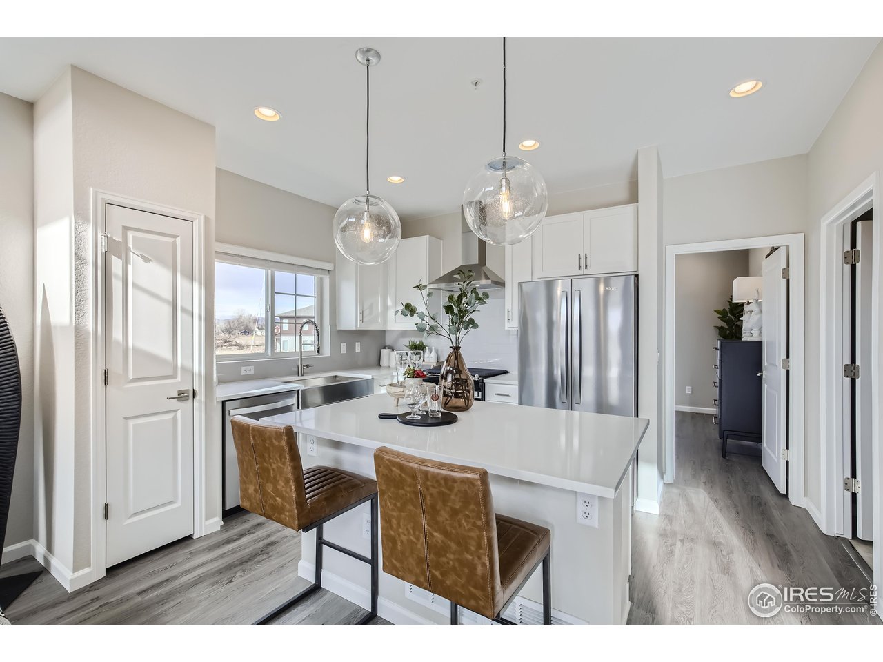 1002 Collamer Drive, Unit 8 Fort Collins, CO 80524 - Photo 14 of 39 a view of kitchen with cabinets and refrigerator