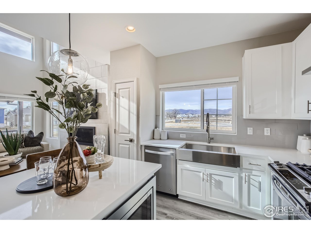 1002 Collamer Drive, Unit 8 Fort Collins, CO 80524 - Photo 15 of 39 a kitchen with appliances a sink and cabinets