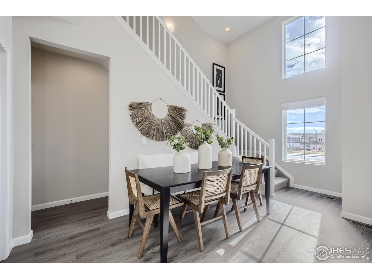 1002 Collamer Drive, Unit 8 Fort Collins, CO 80524 - Photo 19 of 39 a view of a dining room with furniture and a potted plant