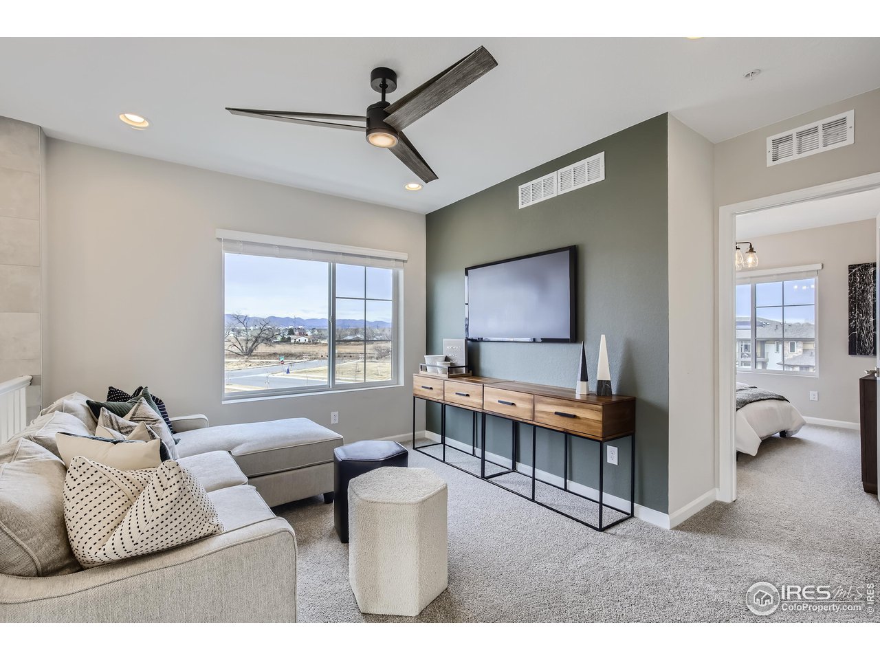 1002 Collamer Drive, Unit 8 Fort Collins, CO 80524 - Photo 20 of 39 a living room with furniture and a large window