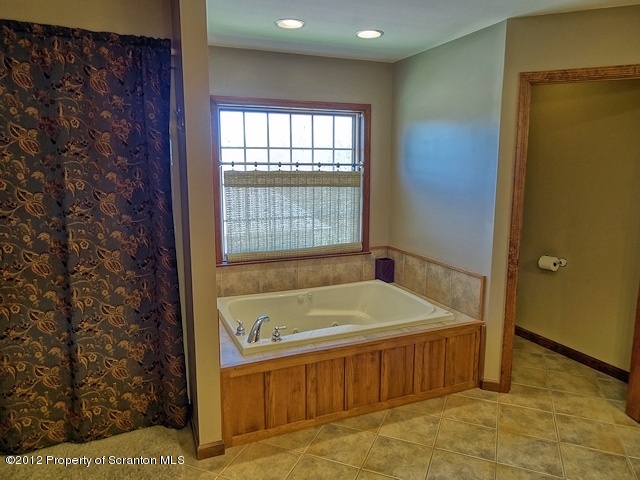 15 North Legend Road Shavertown, PA 18708 - Photo 11 of 23 a bathroom with a tub and shower