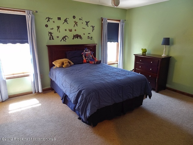 15 North Legend Road Shavertown, PA 18708 - Photo 12 of 23 a bed sitting in a bedroom next to a window