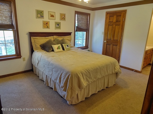 15 North Legend Road Shavertown, PA 18708 - Photo 15 of 23 a bed sitting in a bedroom next to a window