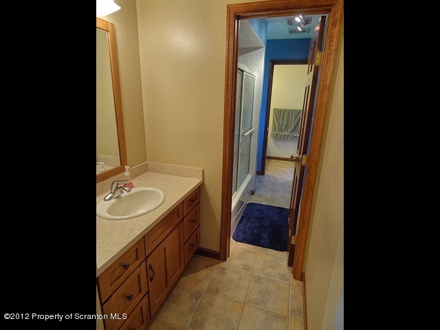 15 North Legend Road Shavertown, PA 18708 - Photo 18 of 23 a bathroom with a sink and a mirror