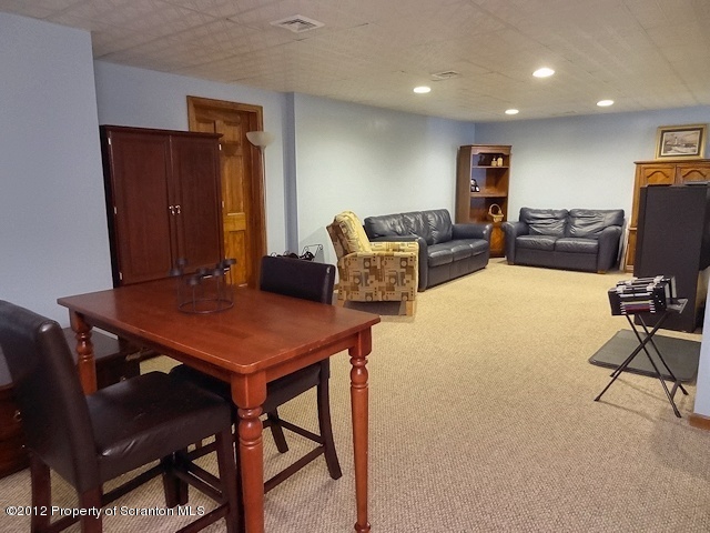 15 North Legend Road Shavertown, PA 18708 - Photo 20 of 23 a living room with furniture a table and a flat screen tv