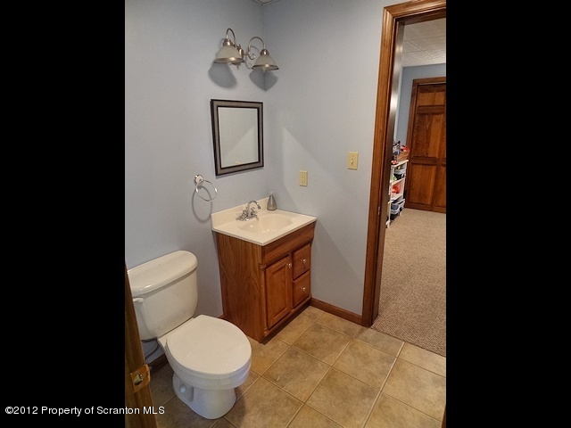 15 North Legend Road Shavertown, PA 18708 - Photo 22 of 23 a bathroom with a toilet sink and mirror