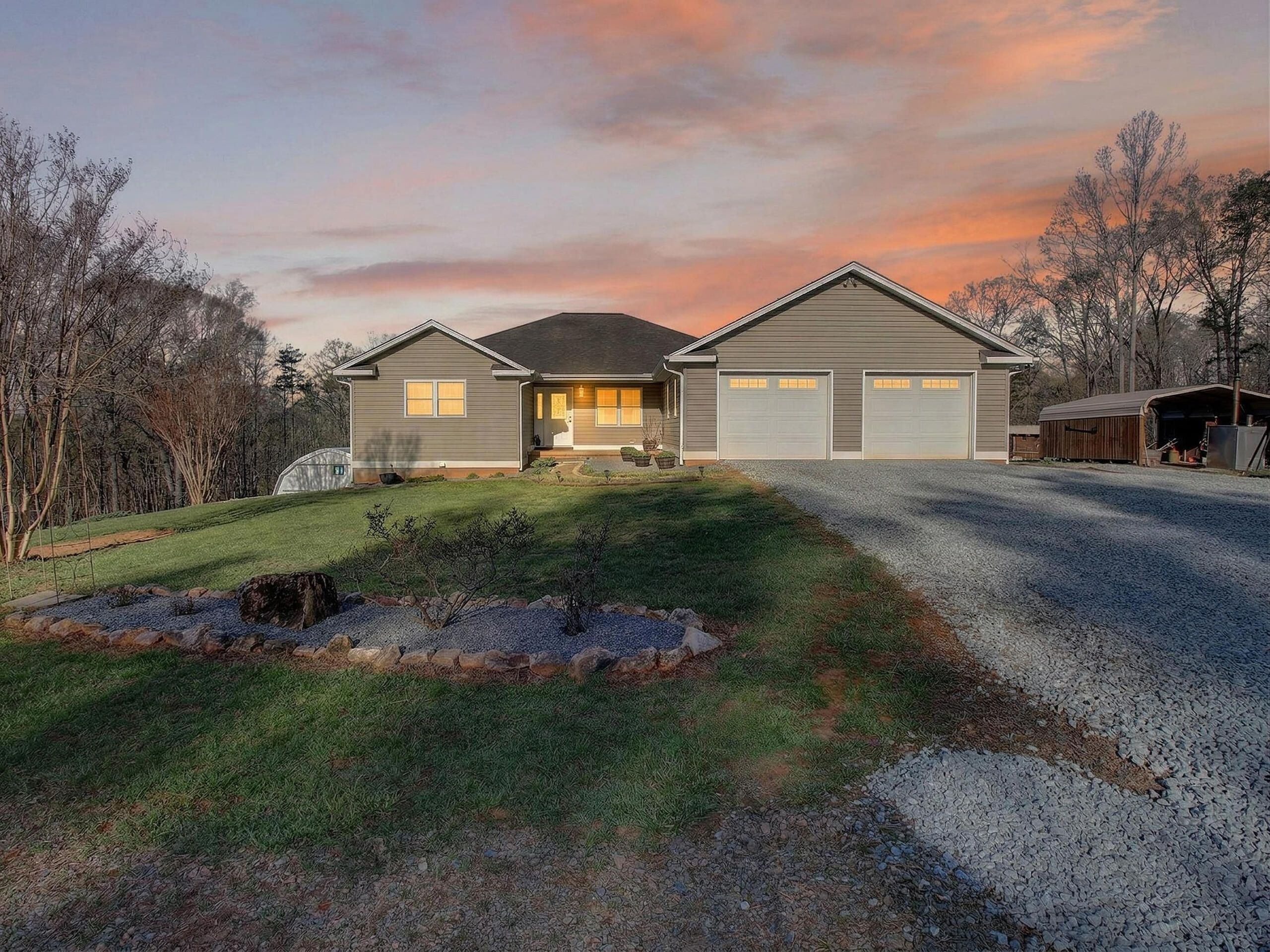 498 Meeks Road Penhook, VA 24137 - Photo 69 of 74 a front view of a house with a garden
