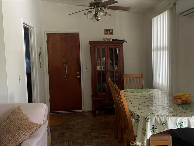 a view of a hallway with furniture and entryway