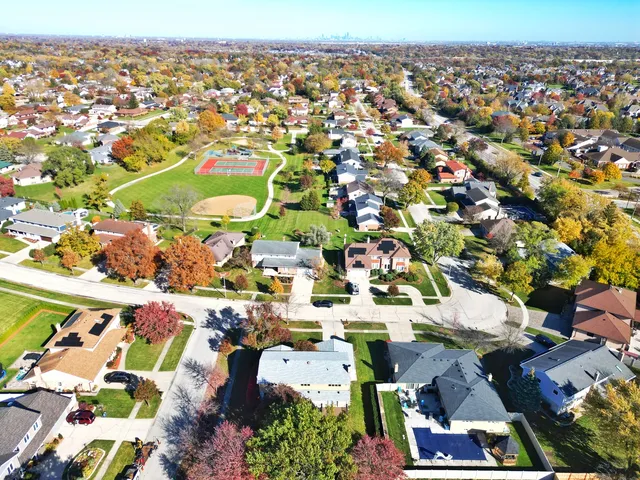 an aerial view of residential houses with outdoor space