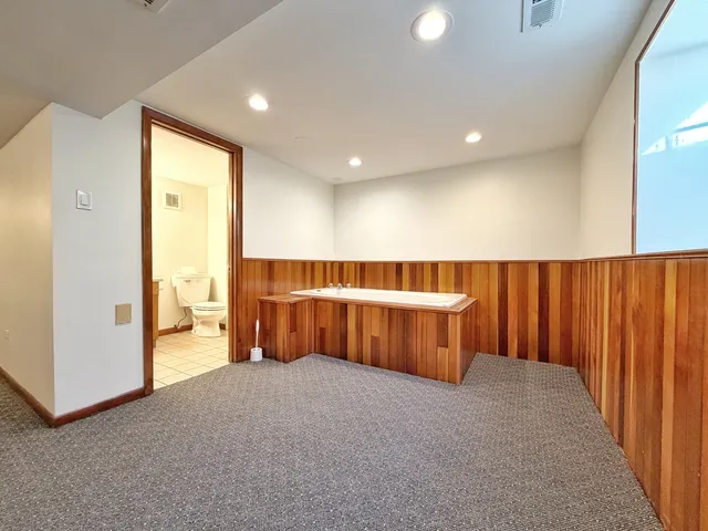 a view of a room with furniture and air conditioner