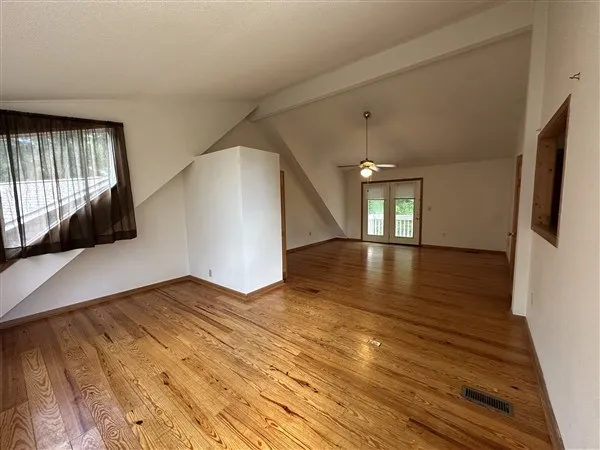 a view of a livingroom with wooden floor