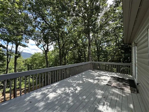 a view of balcony with wooden floor