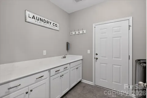 a utility room with cabinets