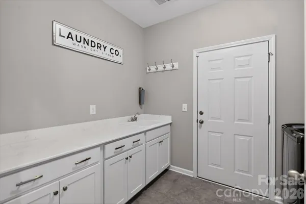 a utility room with cabinets