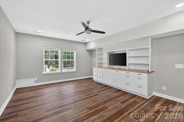 a room with furniture and flat screen tv