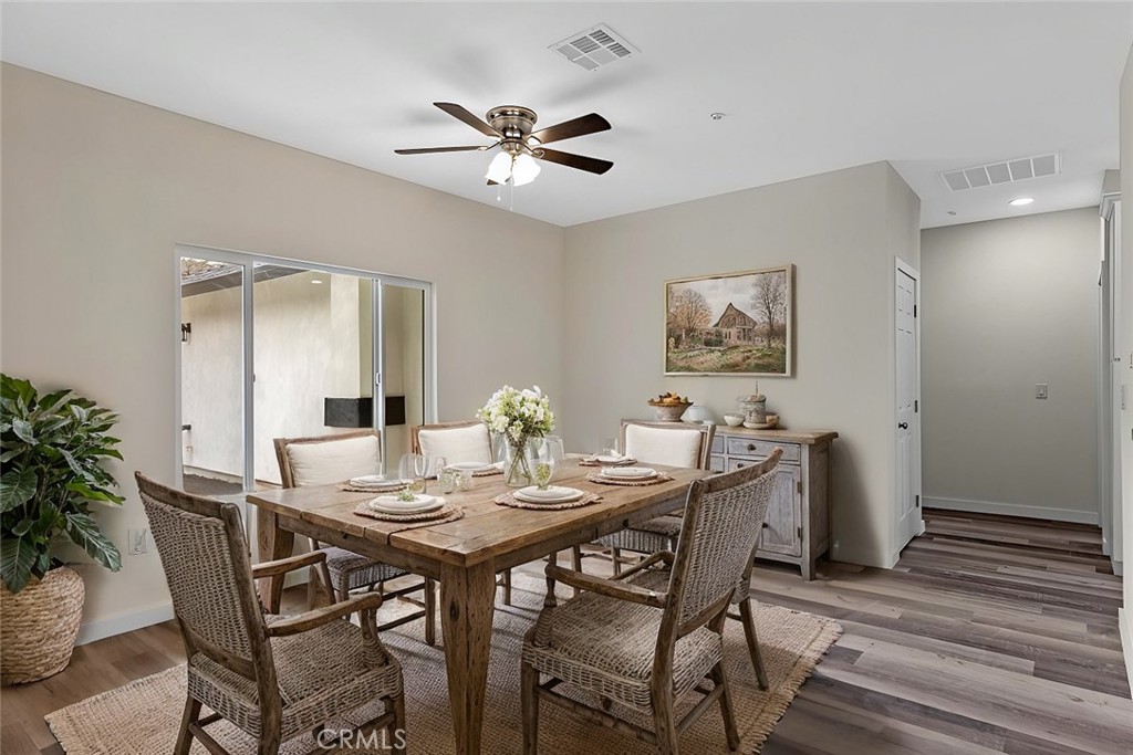 28551 Delaware Drive Tehachapi, CA 93561 - Photo 14 of 34 a view of a dining room with furniture and wooden floor