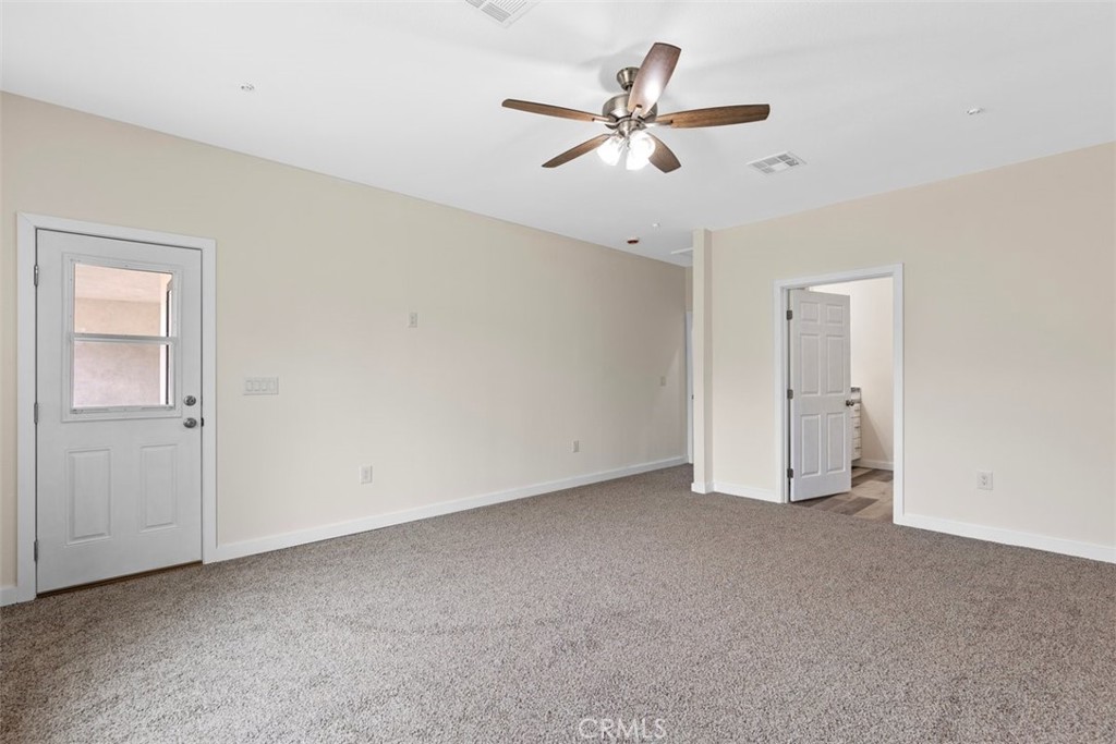28551 Delaware Drive Tehachapi, CA 93561 - Photo 25 of 34 a view of an empty room with a ceiling fan
