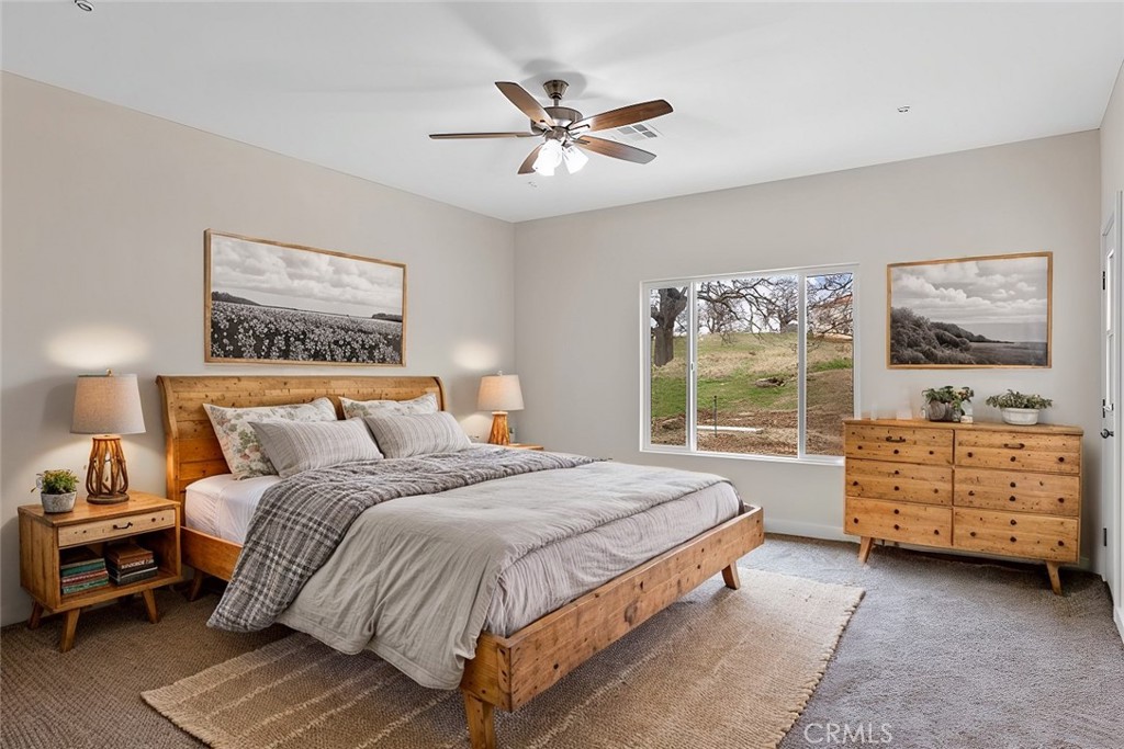 28551 Delaware Drive Tehachapi, CA 93561 - Photo 26 of 34 a bedroom with a bed and a window