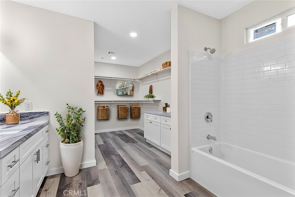 28551 Delaware Drive Tehachapi, CA 93561 - Photo 29 of 34 a bathroom with a granite countertop sink a toilet and shower