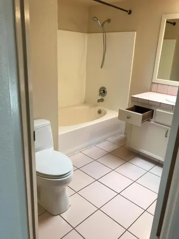 a bathroom with a sink a toilet and a bathtub