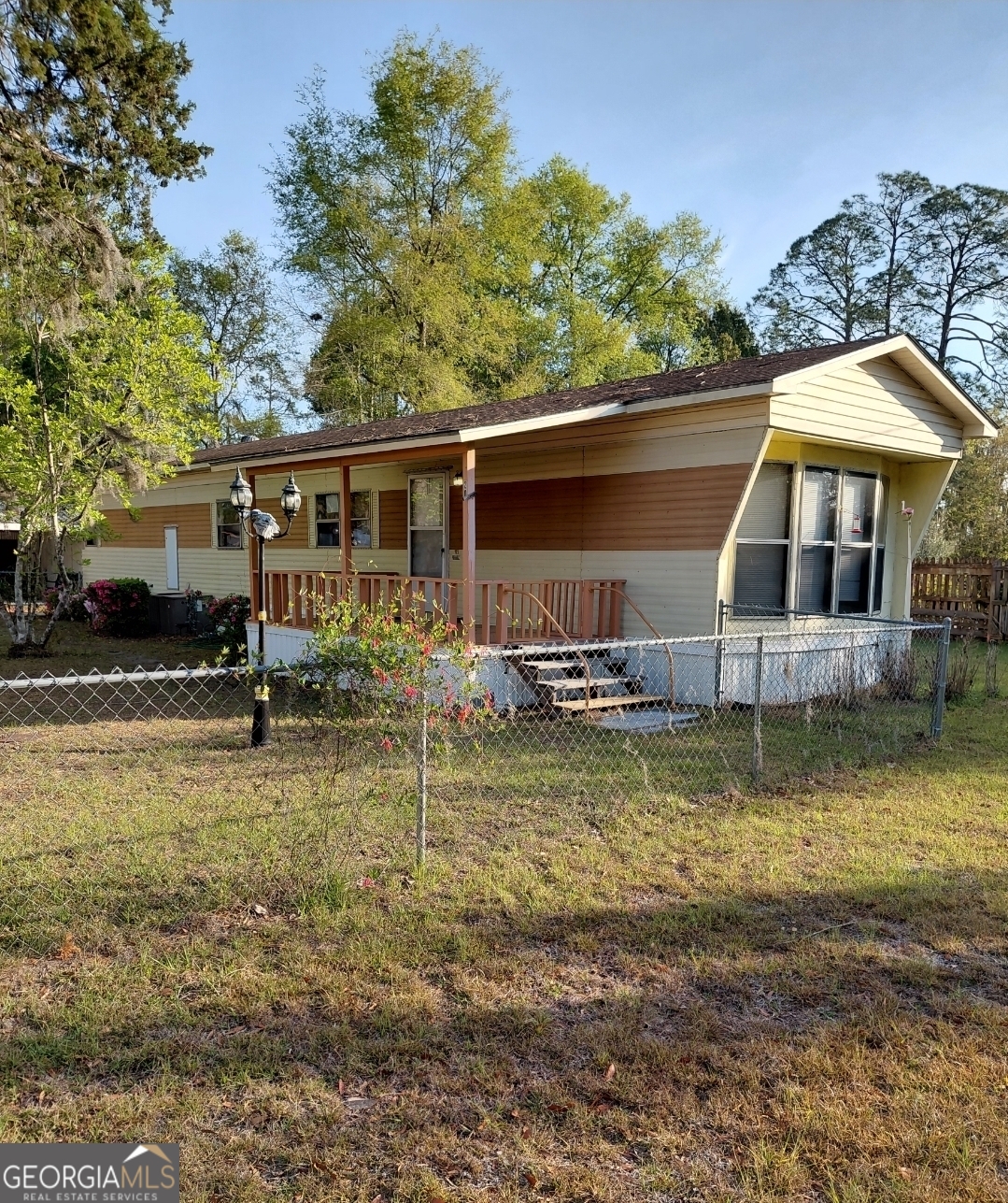 20 Gibson Street Folkston, GA 31537 - Photo 1 of 10 a view of a swimming pool with a patio