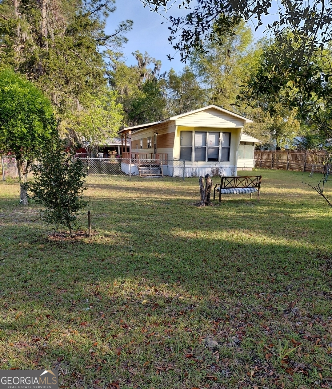 20 Gibson Street Folkston, GA 31537 - Photo 8 of 10 a front view of a house with garden