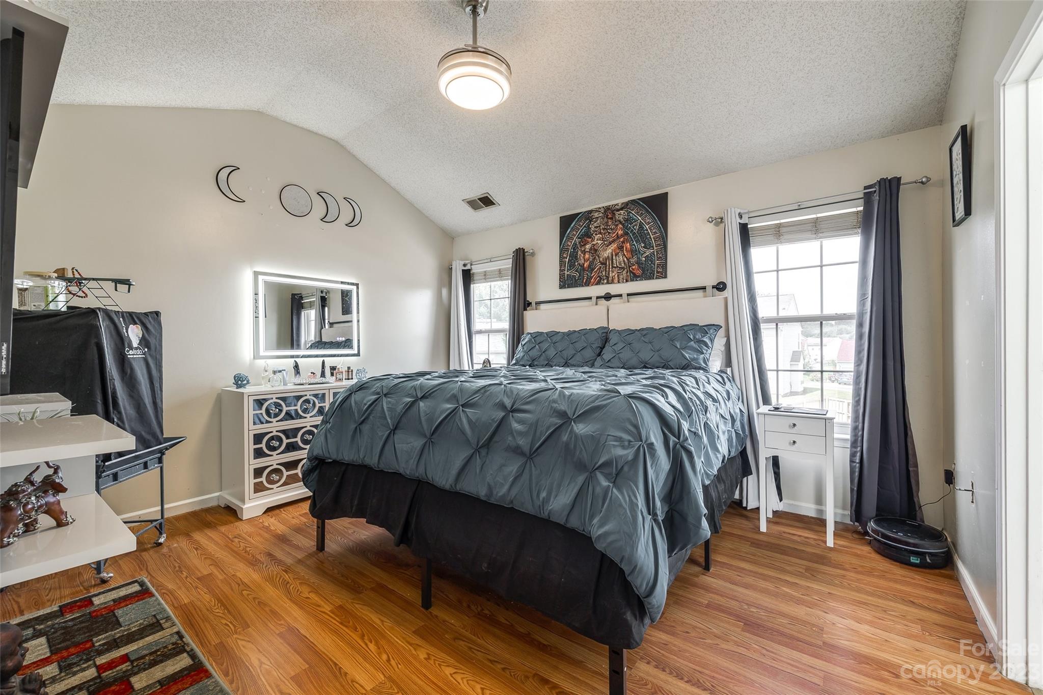 7111 Simbrah Way Charlotte, NC 28273 - Photo 13 of 23 a bedroom with a bed wooden floor and window