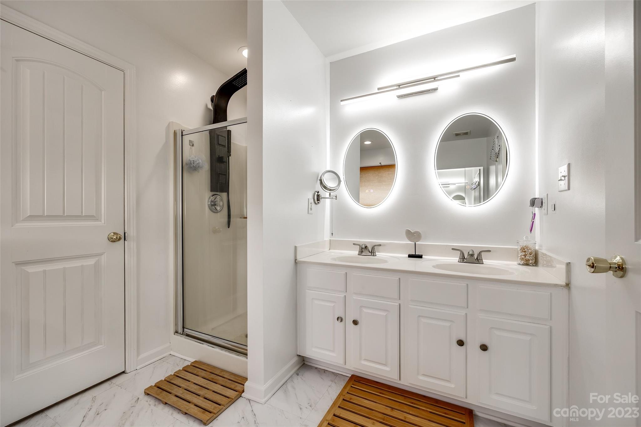 7111 Simbrah Way Charlotte, NC 28273 - Photo 15 of 23 a spacious bathroom with a double vanity sink and mirror