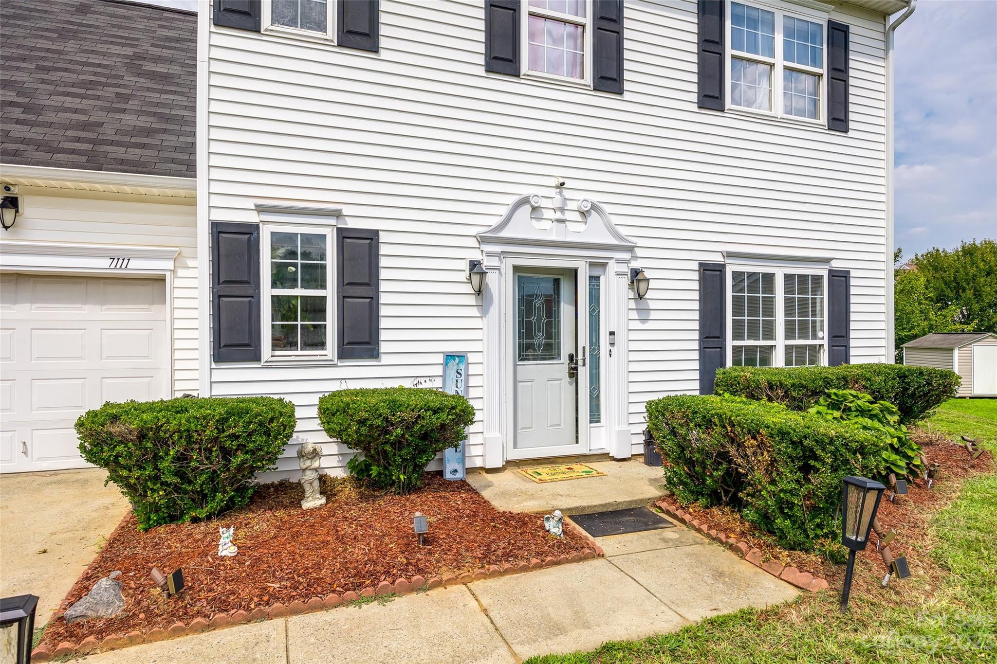7111 Simbrah Way Charlotte, NC 28273 - Photo 2 of 23 a view of a house with a yard