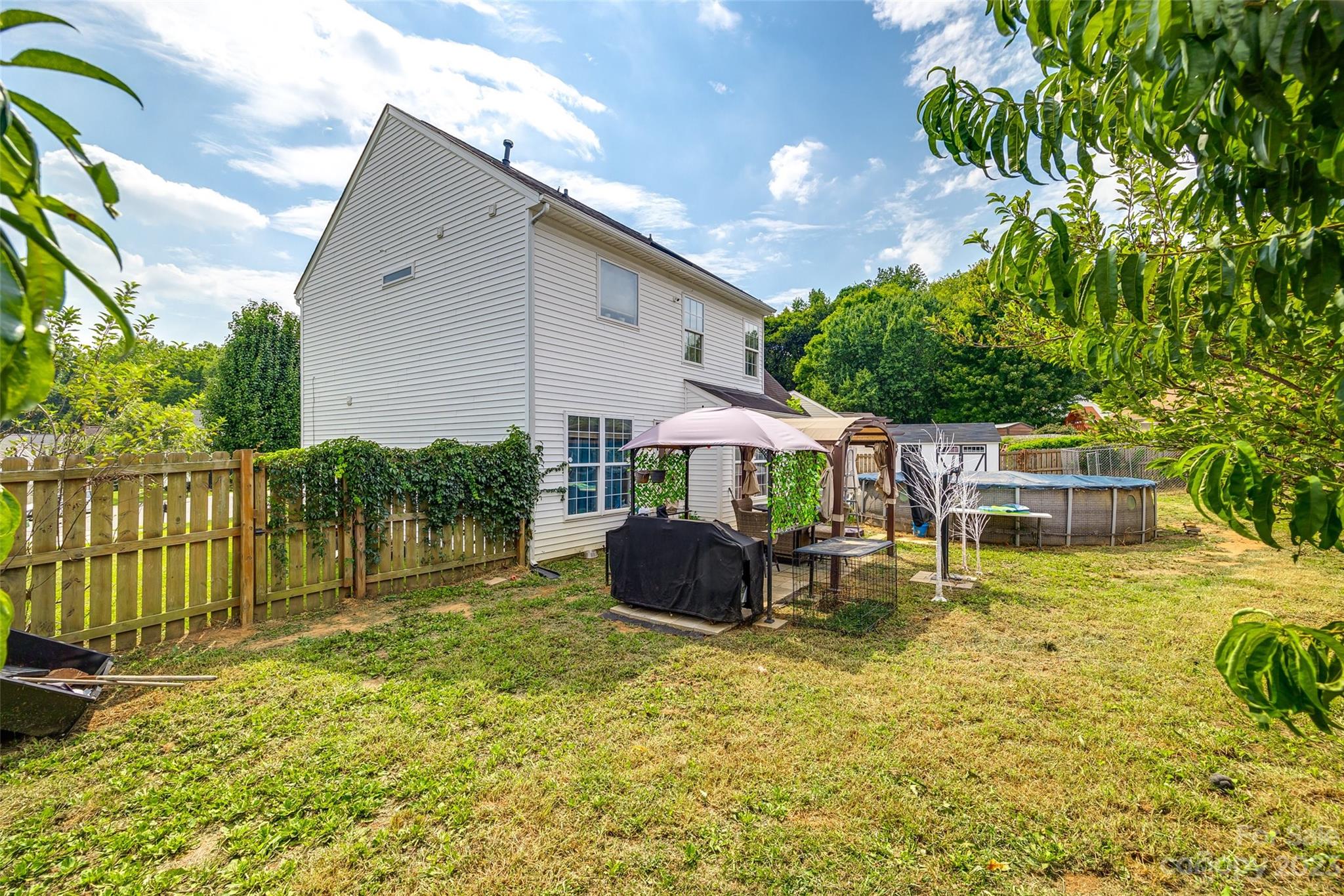 7111 Simbrah Way Charlotte, NC 28273 - Photo 23 of 23 a backyard of a house with yard and outdoor seating