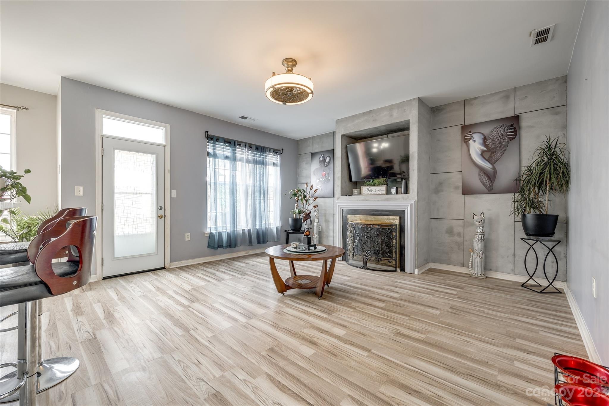 7111 Simbrah Way Charlotte, NC 28273 - Photo 6 of 23 a view of a livingroom with furniture and a fireplace