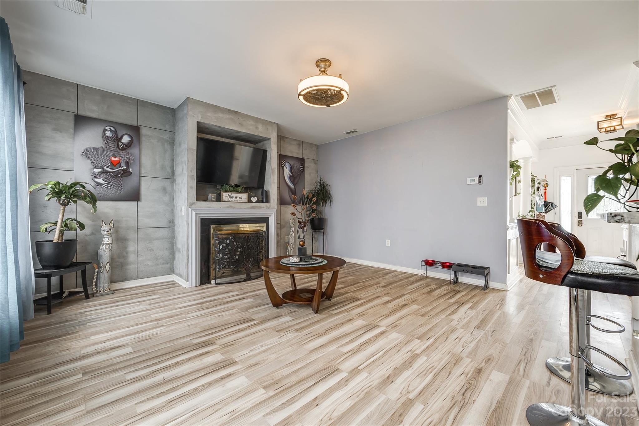 7111 Simbrah Way Charlotte, NC 28273 - Photo 7 of 23 a living room with furniture and a fireplace