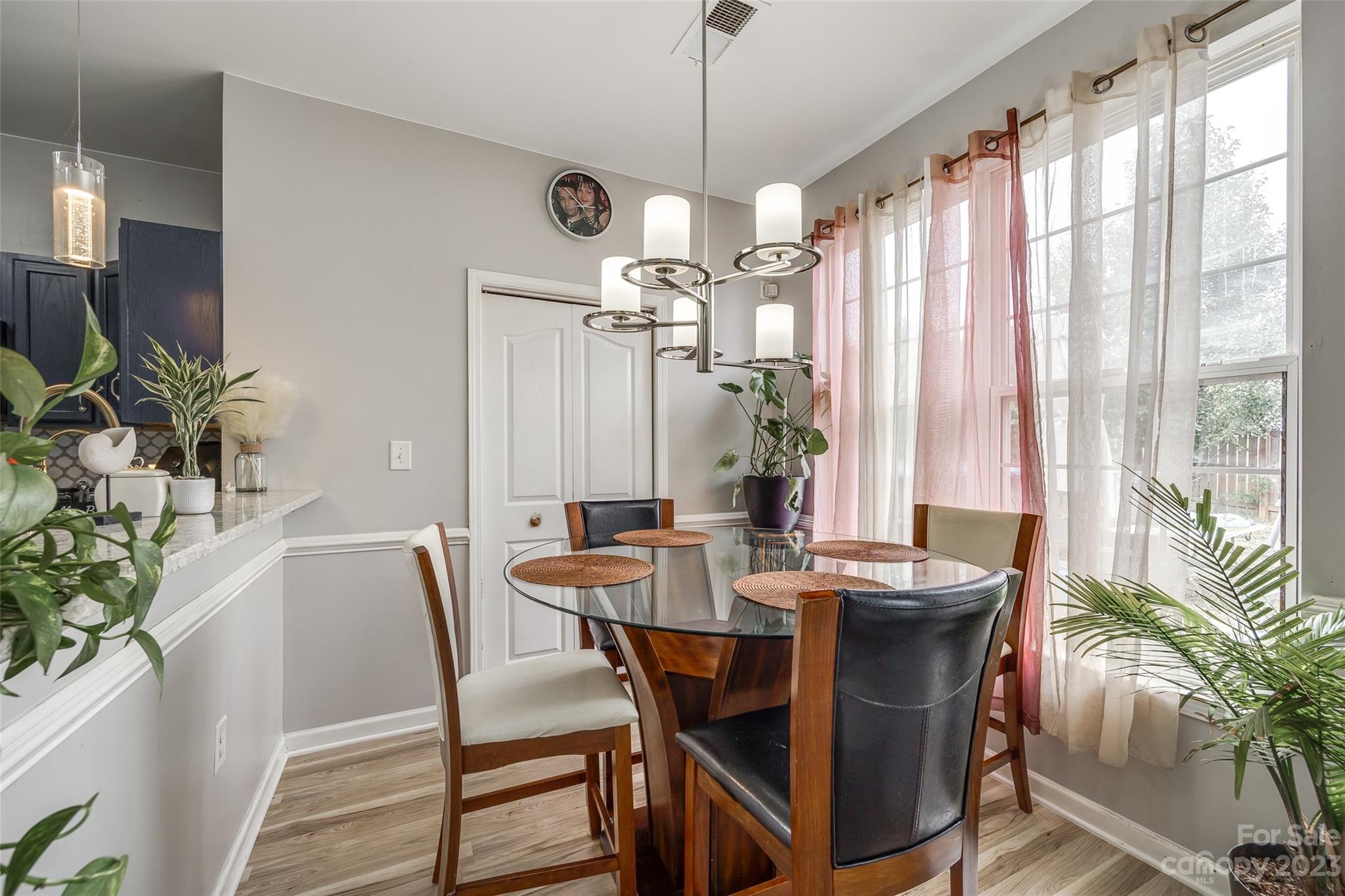 7111 Simbrah Way Charlotte, NC 28273 - Photo 9 of 23 a view of a dining room with furniture window and outside view