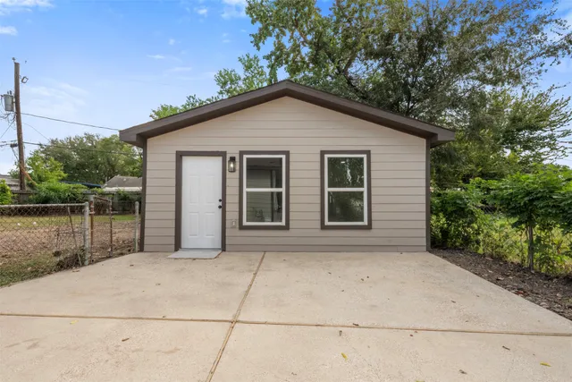 a view of backyard of house and lake view