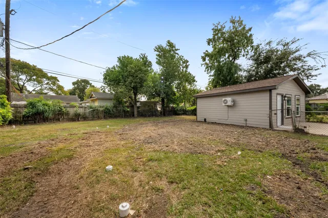 a view of a backyard of the house