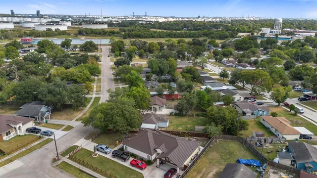 an aerial view of residential houses with outdoor space