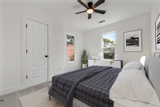 a bedroom with a bed and window