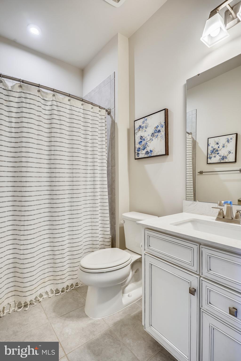 18101 Red Cedar Road Dumfries, VA 22026 - Photo 17 of 49 UL HALL BATH W/ DESIGNER TILE UPGRADE CABINET