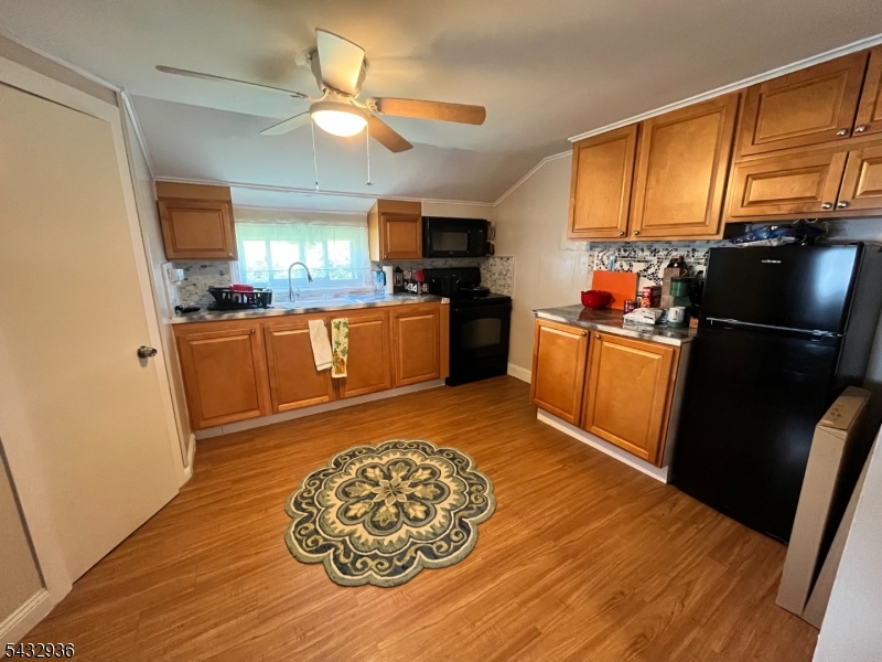 9 New Row Road, Unit A Hibernia, NJ 07842 - Photo 7 of 18 a kitchen with stainless steel appliances granite countertop a refrigerator a stove top oven a sink and dishwasher