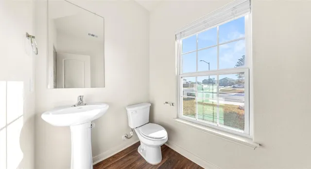 a kitchen with granite countertop kitchen island stainless steel appliances a sink stove and refrigerator