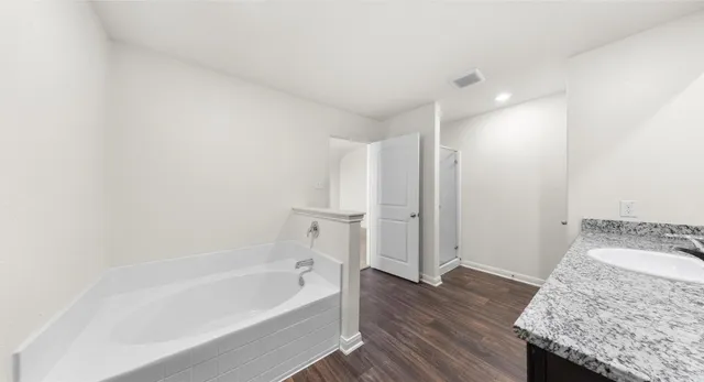 a view of an empty room and a window