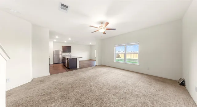 a view of a kitchen with a sink and a window