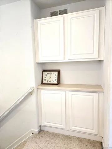 a room with a dresser and a window