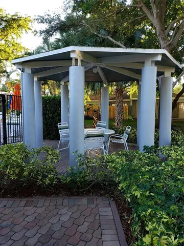 a front view of house with a garden