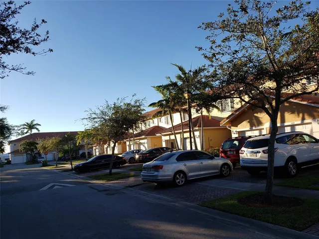 a view of street with parked cars