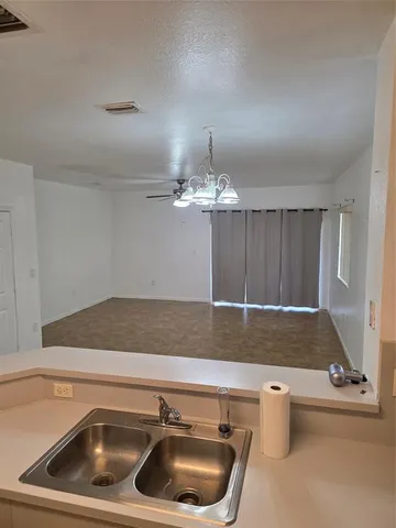 a view of kitchen and sink